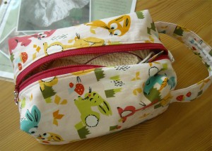 A "stitched by jessalu" box bag
